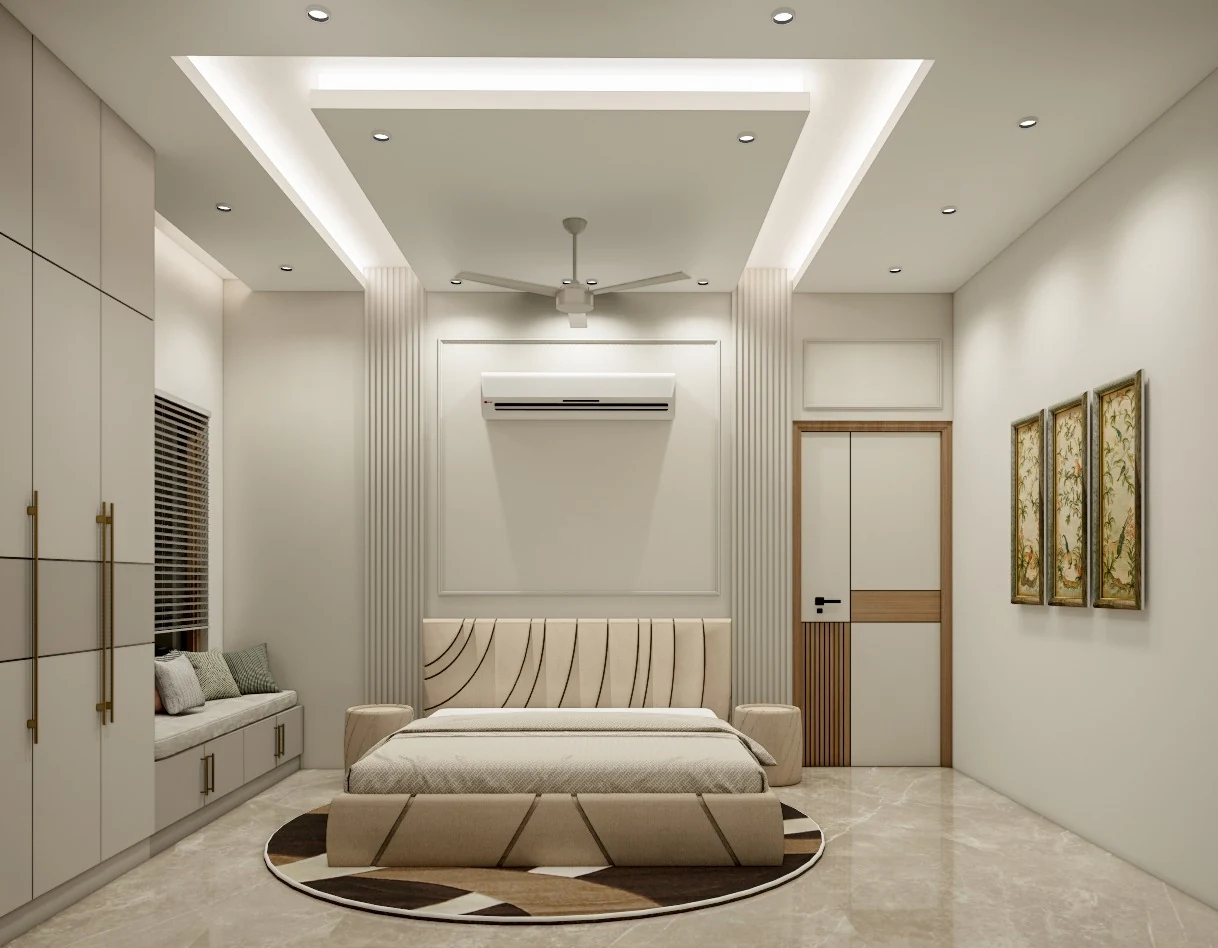 A bedroom with a geometric rug and a pale upholstered bed