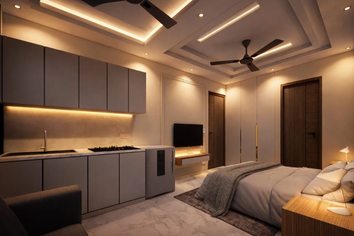 A bedroom and kitchenette in warm graphite tones