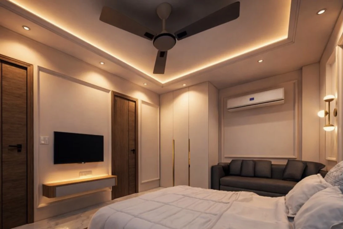 An interior with a grey sofa and concealed ceiling lighting
