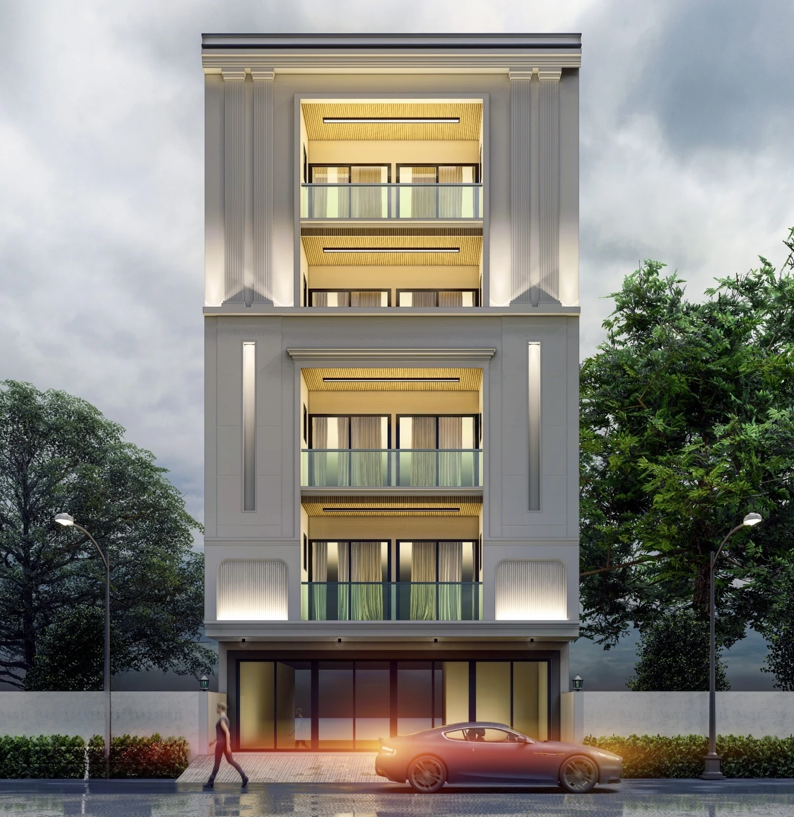 A residential façade with glass balconies and warm lighting